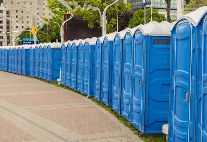 a row of portable restrooms at an outdoor special event, ready for use in Highland Park IL